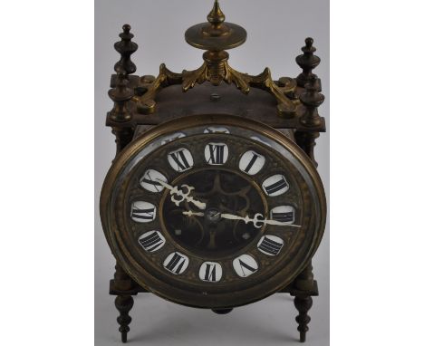 A brass drum mantel clock, the face with individual black Roman numerals on white enamel. H: 20.5cm