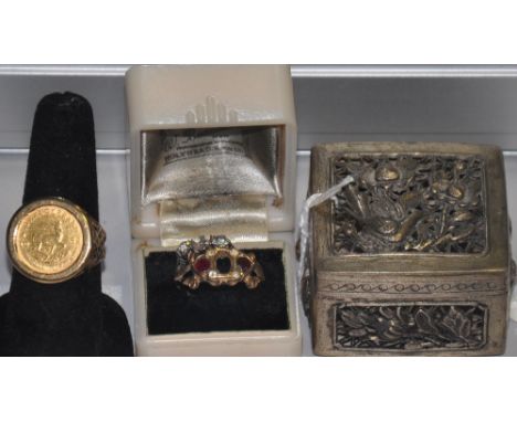 A 1982 one tenth Krugerrand gold coin, ring set in a 9ct gold band together with two 9ct and white metal dress rings (stones 