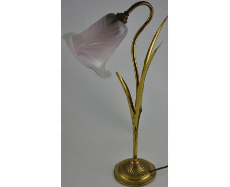 A brass table lamp, modelled as a flower, the glass shade indistinctly signed. H. 54cm