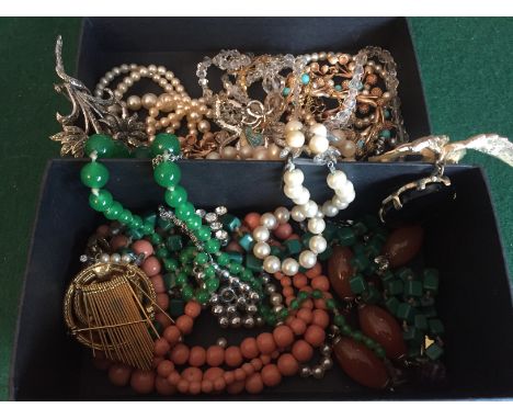 Boxed lot of vintage costume jewellery.