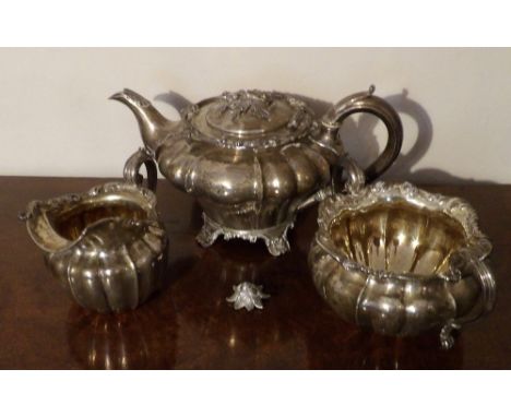Silver teapot a/f 1835 and sugar and creamer 1830 with similar decoration approx. wt 44ozt