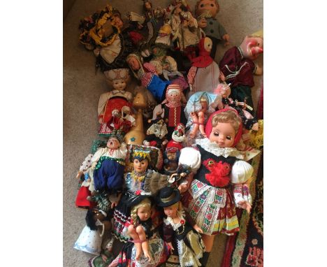 A large quantity of vintage costume dolls.