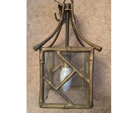 Faux bamboo brass light fitting.
