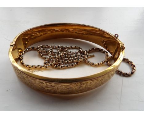 A 9ct gold bangle and a 9ct gold chain 20.2gms