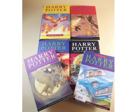 Four Harry Potter first edition books, and two paper backs