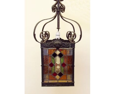 A large Victorian wrought iron and stained glass hall lantern - 74cm total height