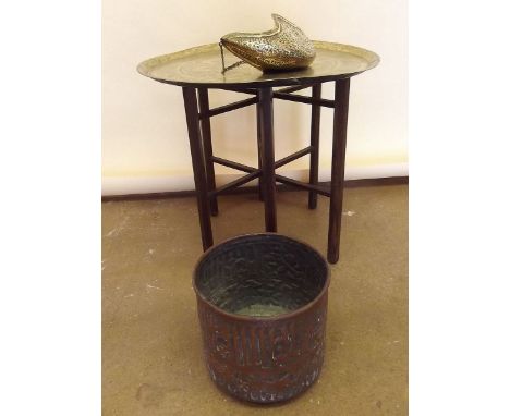 A brass Benares table, copper planter and a brass carrier