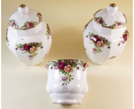 A selection of Royal Albert Country roses comprising:- three covered vases, three small vases, a bell, a covered dish, a sand