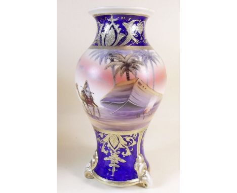 A Noritake vase decorated camel and desert scene