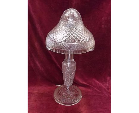 A good quality early 20th century cut glass table lamp and shade with three bulb holder and chrome stem