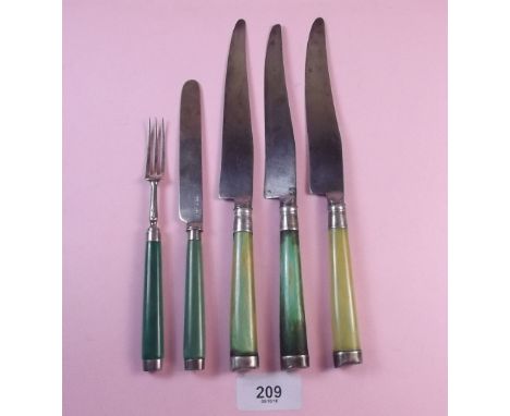 A Georgian silver mounted knife and fork with green stained horn handles (probably London 1811)  and three larger knives with