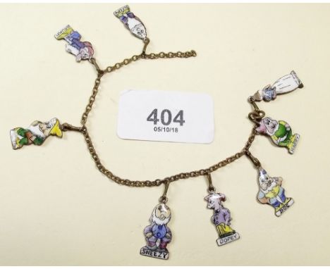 A vintage enamel bracelet decorated Snow White and the Seven Dwarves