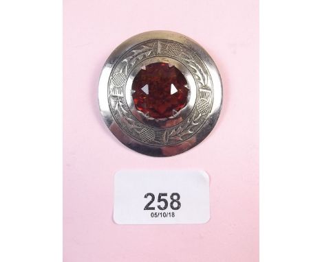 A silver Celtic stone set brooch
