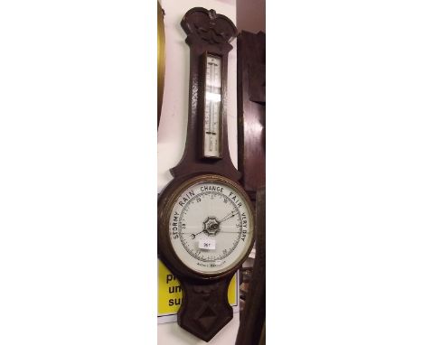 An early 20th century oak framed aneroid banjo barometer/thermometer