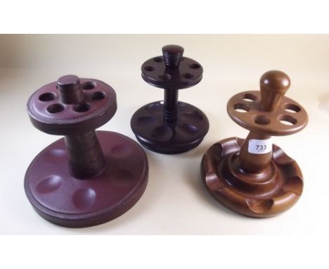Two wooden Dunhill circular pipe racks and one other