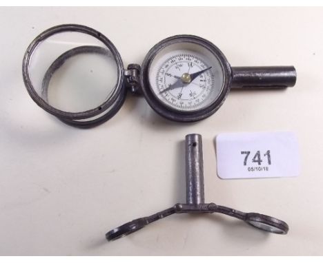 A compass with pair of sighting lenses