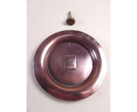 An antique brass seal the carved stone intaglio with farmer sowing seed, and a copper dish made from ship's scrap