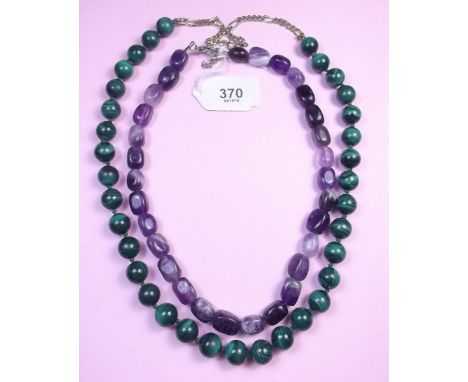 A malachite necklace and an amethyst one