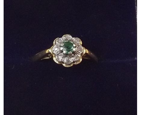 A 9 carat gold emerald and diamond ring, size K 1/2