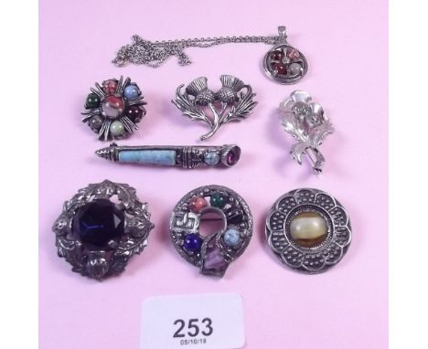 A collection of Scottish Celtic brooches and a similar necklace
