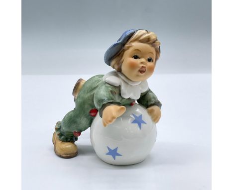 Features a boy dressed in green with a blue hat on top of a ball. Exclusive Edition 2002/2003 M.I Hummel Club. This item has 