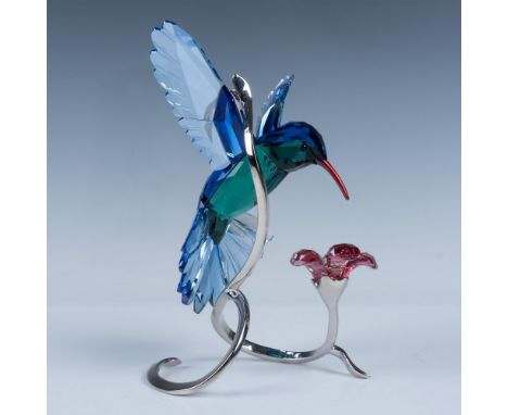 Beautifully executed in natural crystal combined with light and dark sapphire crystal creates a stunning figure affixed to a 