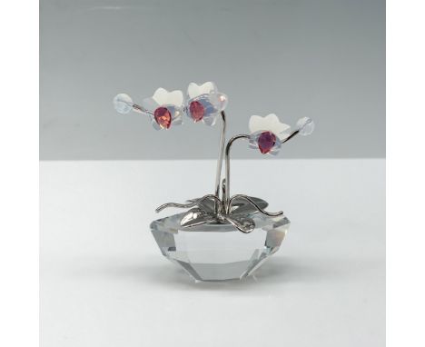 Gorgeous crystal figure of an orchid with pink gemstones that is from the Flower Dreams Collection. Swarovski backstamp. This