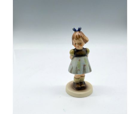 Hand painted young figure colored in blue, brown and yellow. Goebel Hummel backstamp. 493. This item has its original box: 4"
