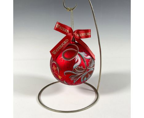 Handcrafted glass bauble adorned with hand-painted flowers in pink, blue, and yellow shades that gracefully curve around the 