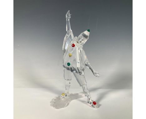 A masquerade clown with open arms is adorned in red, yellow, and green accent crystals, featuring a black teardrop on his fac