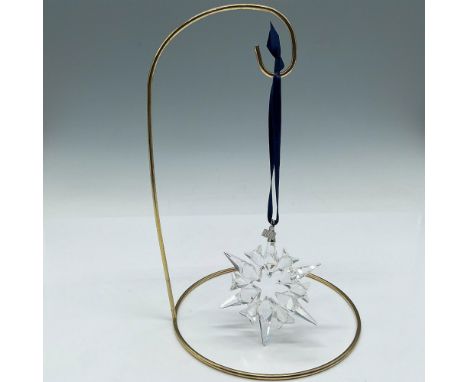 Clear crystal ornament with engraved date tag and blue satin ribbon. Swarovski mark. This item has its original box 6"L x 6"W