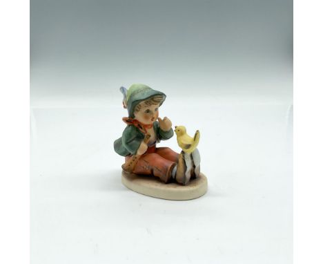 Hand painted figure colored in orange, green and yellow. Goebel Hummel backstamp. 63. Issued: 20th centuryDimensions: 2.75"L 
