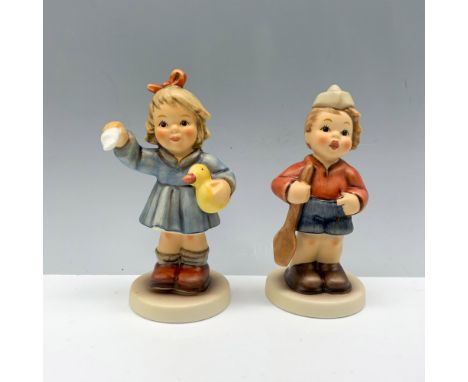 Beautiful duo of figures that includes a little boy wearing a hat and holding an oar, and a little girl holding a handkerchie