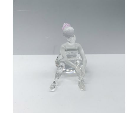 Darling figure of a crystal girl fixing her ballet slipper. Swarovski backstamp. This item has its original box 4"H x 4.75" d