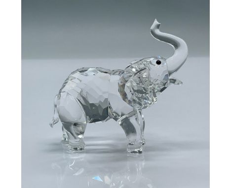 Charming crystal elephant with it's trunk up. This item has its original box measuring 3.25"L x 3.25"W x 4.75"H. Certificate 
