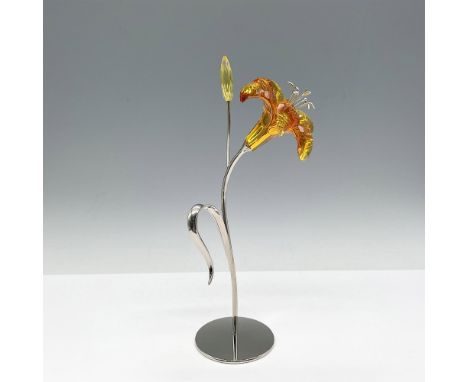 Part of the Exotic Flowers collection. Lovely tiger lily designed with topaz petals and rhodium stem and base. Swarovski impr