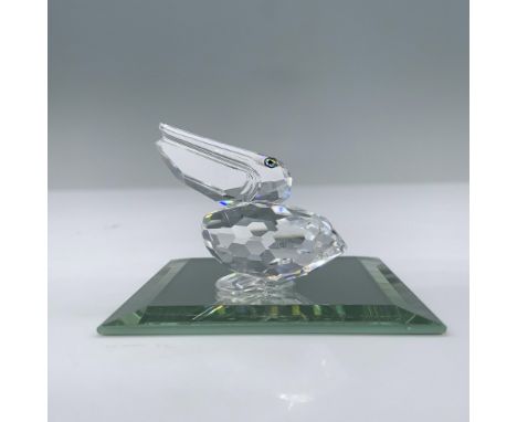 Introduced for the Feathered Friends theme group this bird features a clear faceted body with blue green eyes. This item has 