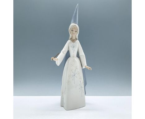 Glossy finish modeled as a fairy holding a gold wand with star. Lladro backstamp. This item has its original box, dimensions: