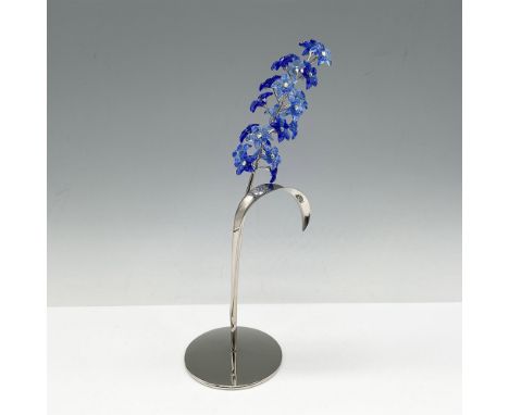 Part of the Exotic Flowers collection colored in blue sapphire crystal flowers set on rhodium stem with round base. Swarovski