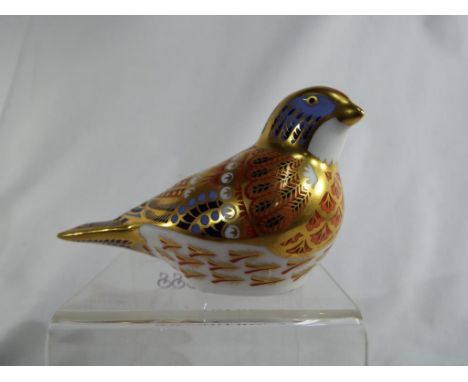 Royal Crown Derby - a paperweight decorated in the Imari pattern in the form of a Linnet, gold button to base - Est £20 - £30