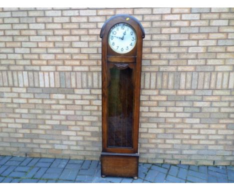 An Art Deco domed top longcase clock, the oak case with full length opening glazed door, Westminster chiming weight driven mo