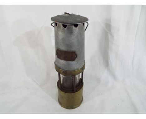 A miners lamp marked J.H. Taylor Ltd Wigan Est 20 - £40