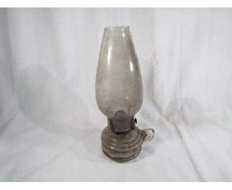 A Victorian oil lamp with glass reservoir and diffuser, 30 cm (high) 