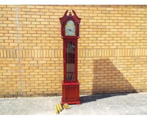 A contemporary grandmother longcase clock, Westminster chiming triple weight driven movement, brass arched dial with applied 