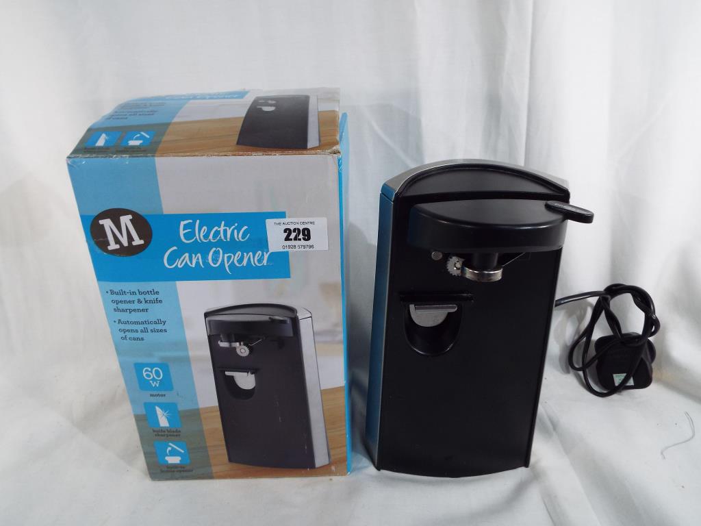 A Morrisons 60 watt electric can opener with builtin bottle opener and