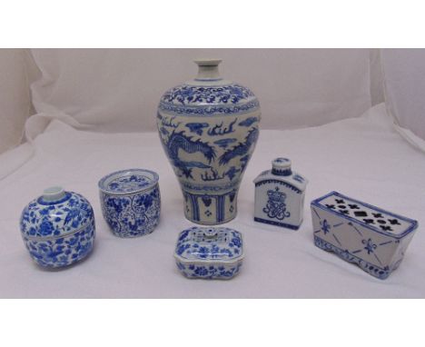 A quantity of 20th century Chinese blue and white porcelain to include a tea caddy, a flower vase and three covered boxes, va