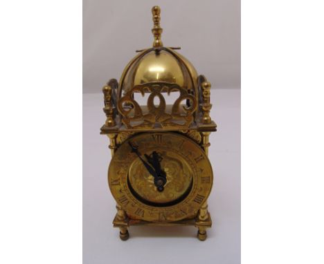 A Smiths brass lantern clock in 17th century style surmounted by bell on four turned peg feet, 17cm (h)