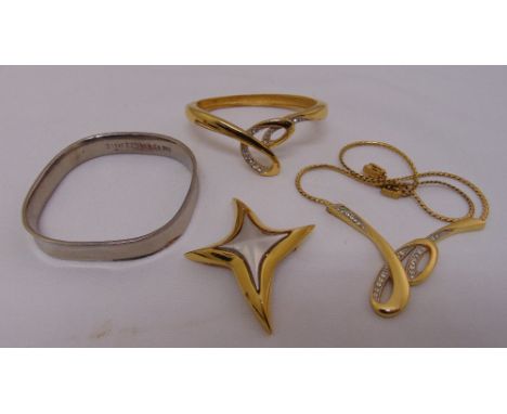 A quantity of costume jewellery to include a Tiffany silver bangle, a Givenchy necklace, bracelet and pendant