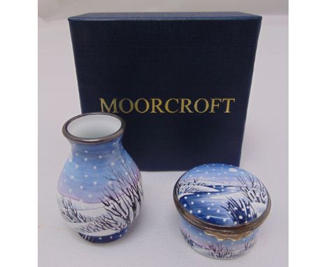 Moorcroft enamel vase decorated with a winter landscape and a matching patch box, both signed to the bases