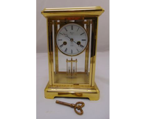 Rapport 8 day gilded metal and glass mercury balance mantle clock, white enamel dial, Roman numerals, to include key and pend